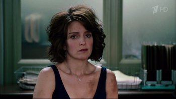 Movie still from “Date Night” (2010), directed by Shawn Levy – A person wearing a dress; Close Up shot, Over the shoulder angle