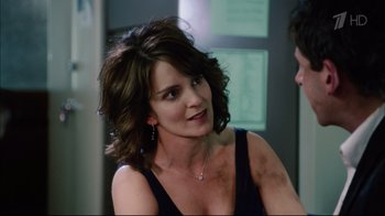 Movie still from “Date Night” (2010), directed by Shawn Levy – A person wearing a dress; Close Up shot, Over the shoulder angle