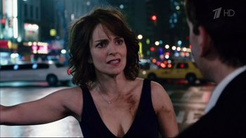 Movie still from “Date Night” (2010), directed by Shawn Levy – A woman in a black top is standing in the street; Close Up shot, Over the shoulder angle