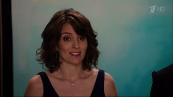 Movie still from “Date Night” (2010), directed by Shawn Levy – A person wearing a necklace; Close Up shot, Over the shoulder angle