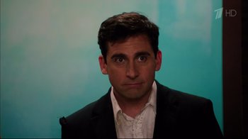 Movie still from “Date Night” (2010), directed by Shawn Levy – A person wearing a suit and tie; Close Up shot, Over the shoulder angle