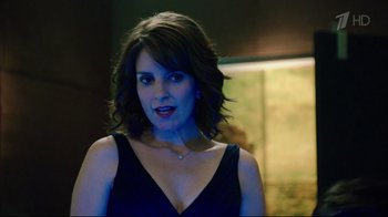 Movie still from “Date Night” (2010), directed by Shawn Levy – A woman in a black dress is looking at the camera; Close Up shot, Over the shoulder angle