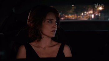 Movie still from “Date Night” (2010), directed by Shawn Levy – A woman sitting in the back seat of a car at night; Close Up shot, Over the shoulder angle