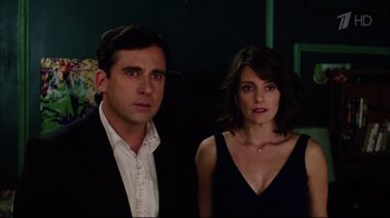 Movie still from “Date Night” (2010), directed by Shawn Levy – A man and a woman standing next to each other in a room; Medium shot, Over the shoulder angle