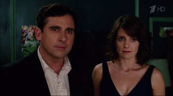 Movie still from “Date Night” (2010), directed by Shawn Levy – A man and a woman standing next to each other; Close Up shot, Low angle
