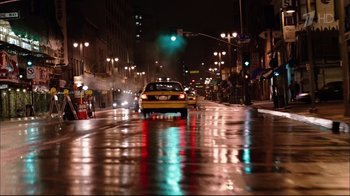 Movie still from “Date Night” (2010), directed by Shawn Levy – A yellow taxi driving down a wet street at night; Extreme Wide shot, High angle