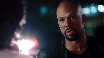 Movie still from “Date Night” (2010), directed by Shawn Levy – A man with a bald head is looking at the camera; Close Up shot, Over the shoulder angle