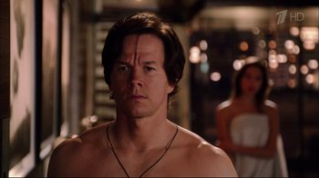 Movie still from “Date Night” (2010), directed by Shawn Levy – A man with no shirt is standing next to a woman; Close Up shot, Over the shoulder angle