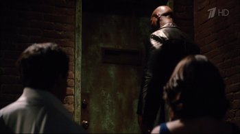 Movie still from “Date Night” (2010), directed by Shawn Levy – A man standing in front of an open door; Medium shot, Over the shoulder angle