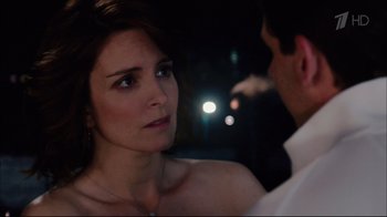 Movie still from “Date Night” (2010), directed by Shawn Levy – A man and a woman standing next to each other in the dark; Close Up shot, Over the shoulder angle