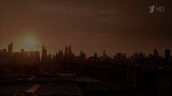 Movie still from “Date Night” (2010), directed by Shawn Levy – The sun is setting over a city skyline; Extreme Wide shot, Low angle