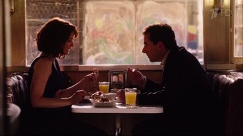 Movie still from “Date Night” (2010), directed by Shawn Levy – A man and a woman sitting at a dinner table; Medium shot, High angle