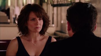 Movie still from “Date Night” (2010), directed by Shawn Levy – A man and a woman looking at one another in front of a mirror; Close Up shot, Over the shoulder angle