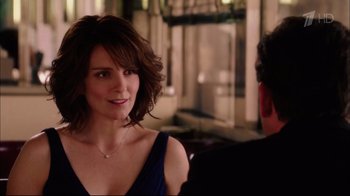Movie still from “Date Night” (2010), directed by Shawn Levy – A beautiful woman in a blue dress talking to a man; Close Up shot, Over the shoulder angle