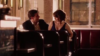 Movie still from “Date Night” (2010), directed by Shawn Levy – A man and a woman sitting next to each other; Medium shot, Over the shoulder angle