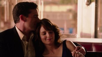 Movie still from “Date Night” (2010), directed by Shawn Levy – A man and a woman are looking at a cell phone; Close Up shot, High angle