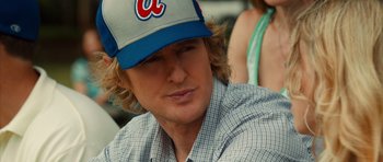 Movie still from “The Internship” (2013), directed by Shawn Levy – A person wearing a baseball cap; Close Up shot, Over the shoulder angle