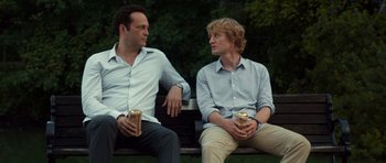Movie still from “The Internship” (2013), directed by Shawn Levy – A couple of men sitting next to each other on a park bench; Medium shot, Over the shoulder angle