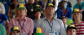 Movie still from “The Internship” (2013), directed by Shawn Levy – A group of people in a room wearing hats; Medium shot, Over the shoulder angle