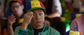 Movie still from “The Internship” (2013), directed by Shawn Levy – A young man wearing a google hat with his hand to his face; Close Up shot, Over the shoulder angle