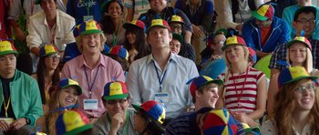 Movie still from “The Internship” (2013), directed by Shawn Levy – A group of people sitting and standing wearing hats; Medium shot, Over the shoulder angle