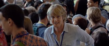 Movie still from “The Internship” (2013), directed by Shawn Levy – A man with blonde hair is smiling at a crowd of onlookers; Close Up shot, Over the shoulder angle