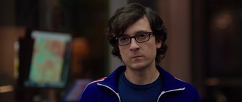 Movie still from “The Internship” (2013), directed by Shawn Levy – A man with glasses and a blue jacket looking to his left; Close Up shot, Over the shoulder angle