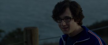 Movie still from “The Internship” (2013), directed by Shawn Levy – A young man with glasses is looking at the camera; Close Up shot, Over the shoulder angle