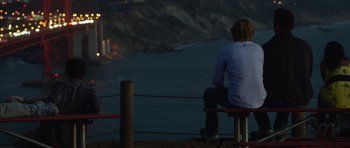 Movie still from “The Internship” (2013), directed by Shawn Levy – A man sitting on a bench looking out at the ocean; Wide shot, High angle