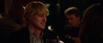 Movie still from “The Internship” (2013), directed by Shawn Levy – A man sitting at a table with a glass of wine; Close Up shot, Over the shoulder angle
