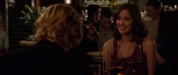 Movie still from “The Internship” (2013), directed by Shawn Levy – A group of people sitting around a table with wine glasses; Close Up shot, Over the shoulder angle