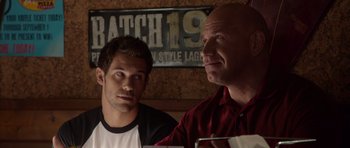 Movie still from “The Internship” (2013), directed by Shawn Levy – Two men sitting at a table in front of each other; Close Up shot, Over the shoulder angle