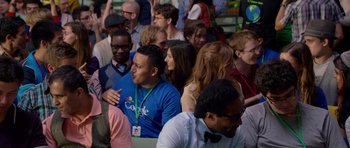 Movie still from “The Internship” (2013), directed by Shawn Levy – A group of people sitting in front of each other at an event; Medium shot, Over the shoulder angle