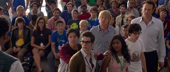 Movie still from “The Internship” (2013), directed by Shawn Levy – A large group of people standing in a room together; Medium shot, Over the shoulder angle