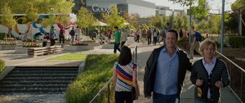 Movie still from “The Internship” (2013), directed by Shawn Levy – A group of people walking down a sidewalk near a google building; Medium shot, Over the shoulder angle