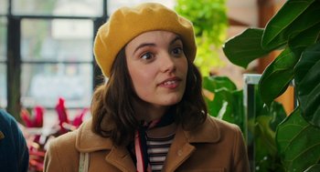 A woman wearing a yellow hat and a jacket