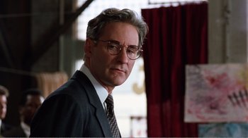 Movie still from “Dave” (1993), directed by Ivan Reitman – A person wearing a suit and tie; Close Up shot, Low angle