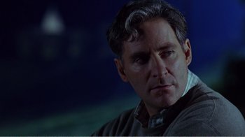 Movie still from “Dave” (1993), directed by Ivan Reitman – A person wearing a sweater; Close Up shot, Over the shoulder angle