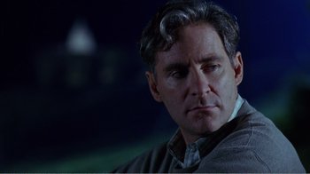 Movie still from “Dave” (1993), directed by Ivan Reitman – A person wearing a sweater; Close Up shot, Over the shoulder angle