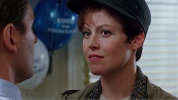 Movie still from “Dave” (1993), directed by Ivan Reitman – A person wearing a hat; Close Up shot, Over the shoulder angle