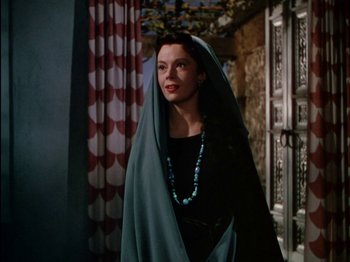 Movie still from “David and Bathsheba” (1951), directed by Henry King – A woman in a black dress with a blue shawl; Medium shot, Low angle