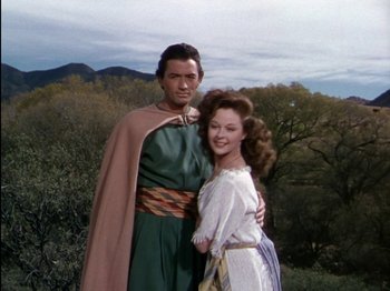 Movie still from “David and Bathsheba” (1951), directed by Henry King – A man and a woman standing next to each other in front of trees; Medium shot, Low angle