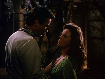 Movie still from “David and Bathsheba” (1951), directed by Henry King – A man and a woman standing next to each other; Medium shot, Over the shoulder angle
