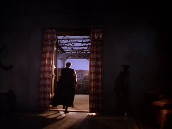 Movie still from “David and Bathsheba” (1951), directed by Henry King – A person standing in a room with a horse; Wide shot, Low angle