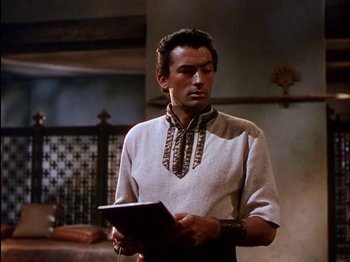 Movie still from “David and Bathsheba” (1951), directed by Henry King – A man holding a tablet in his hands; Medium shot, Over the shoulder angle
