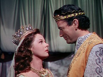 Movie still from “David and Bathsheba” (1951), directed by Henry King – A man and a woman wearing crowns and holding hands; Medium shot, Low angle