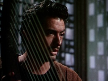 Movie still from “David and Bathsheba” (1951), directed by Henry King – A person holding a harp; Close Up shot, Low angle