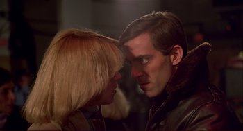 Movie still from “Dawn of the Dead” (1978), directed by George A. Romero – A man and a woman face to face in the dark; Close Up shot, Over the shoulder angle