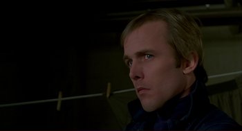 Movie still from “Dawn of the Dead” (1978), directed by George A. Romero – A person wearing a jacket; Close Up shot, Low angle