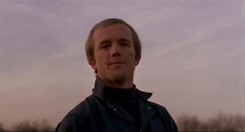 Movie still from “Dawn of the Dead” (1978), directed by George A. Romero – A person wearing a jacket; Close Up shot, Low angle